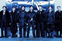 the seven members of Korean pop band BTS stand in a row