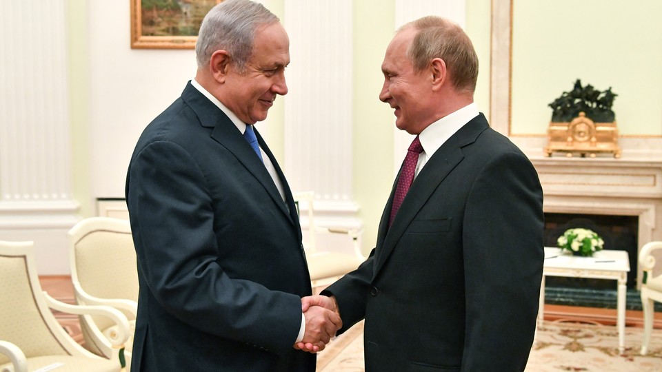 Netanyahu and Putin shake hands at a meeting at the Kremlin in July.
