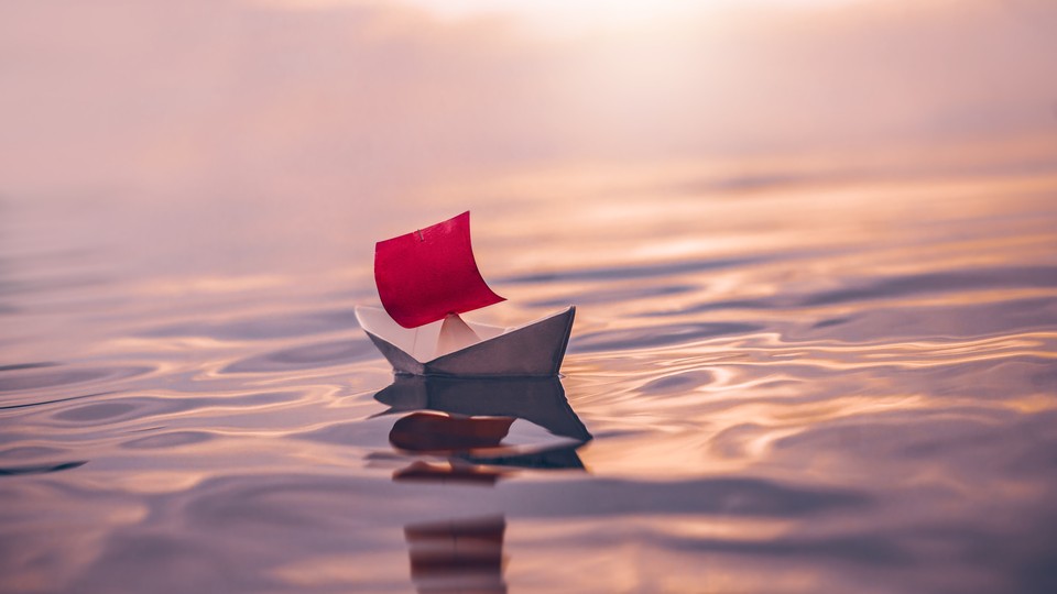 A paper boat on water