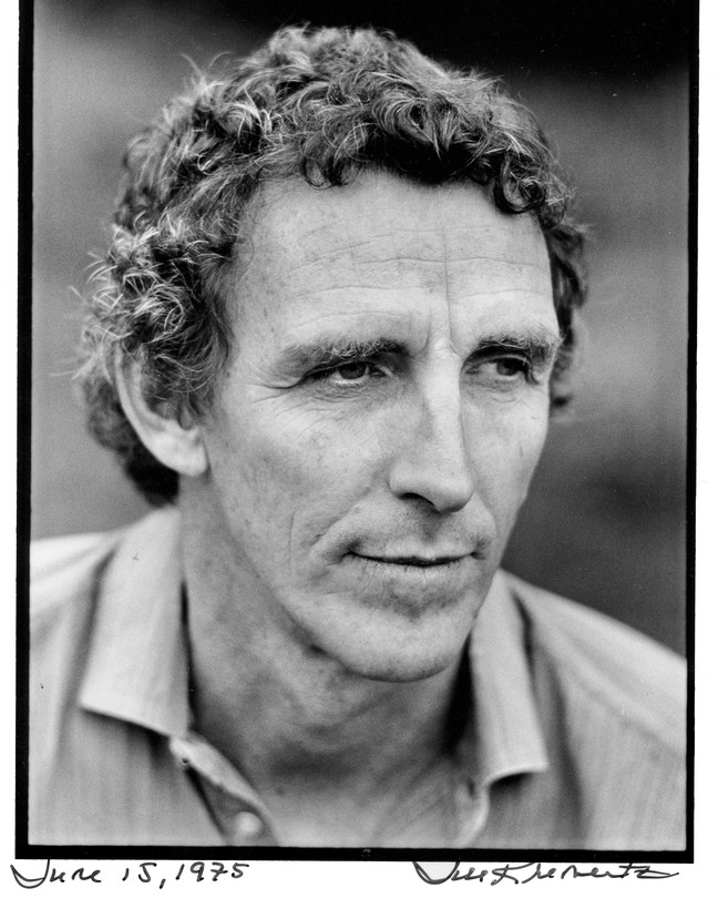 A black-and-white photograph of Peter Matthiessen in a collared shirt, looking off camera to the right.