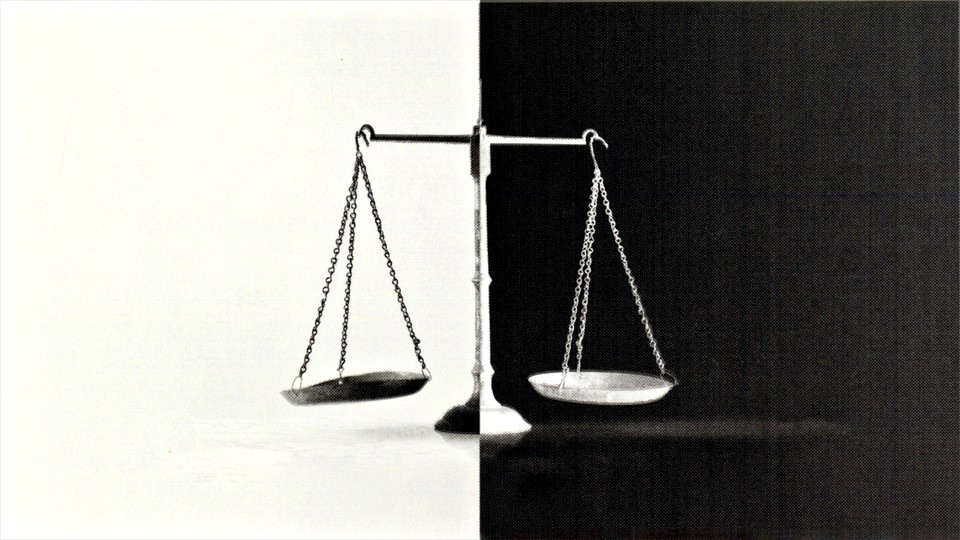 A scale split in two. Half is black over a white background and the other half is white over a black background.