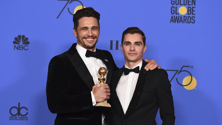 James Franco and Dave Franco pose after the former wins the Golden Globe for Best Actor in a Drama for 'The Disaster Artist'