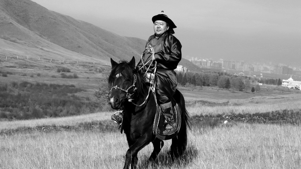 Tsakhia Elbegdorj rides a horse.