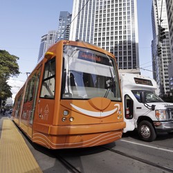 A streetcar with the Amazon logo on a Seattle street