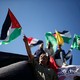 Palestinians celebrate after Hamas said it reached a deal with Palestinian rival Fatah, in Gaza City.