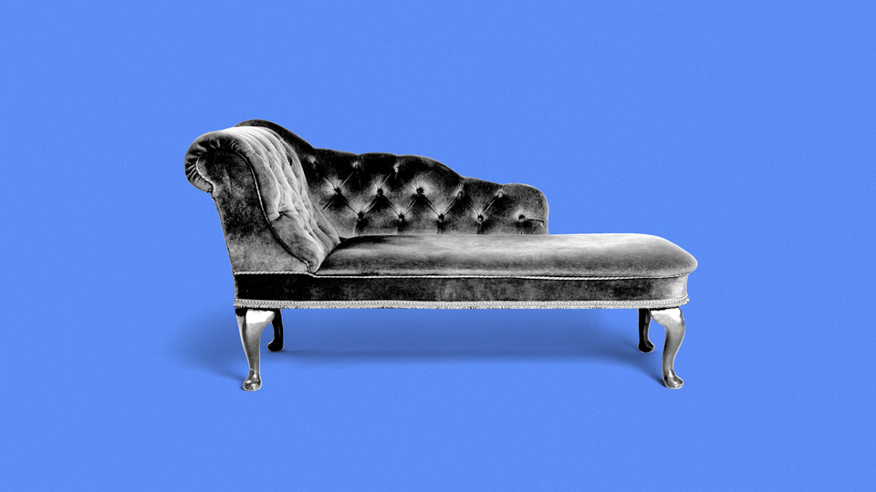A picture of a therapist's couch against a blue background