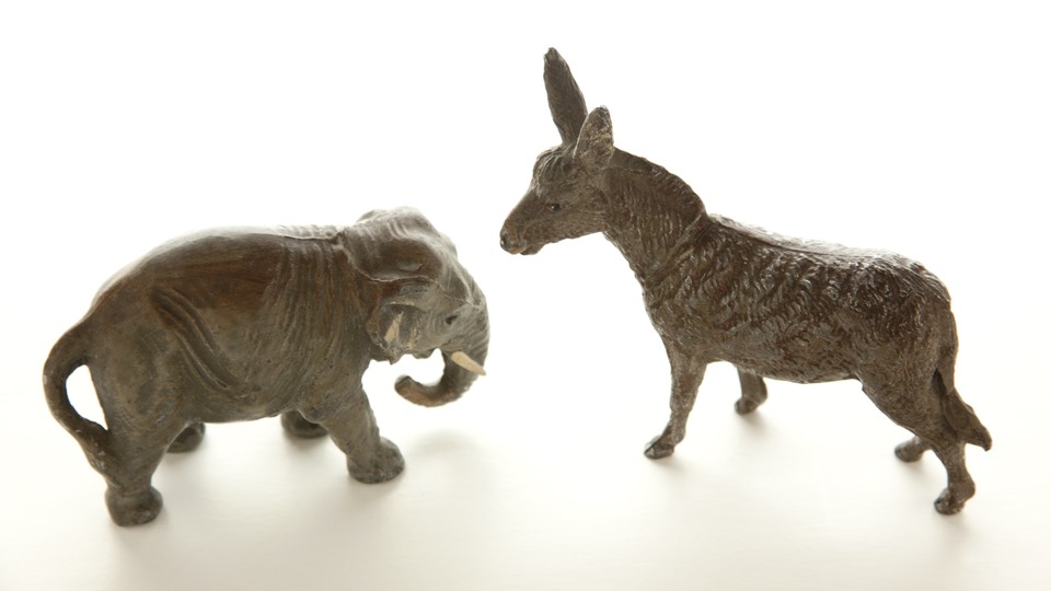 Two figurines of a donkey and an elephant