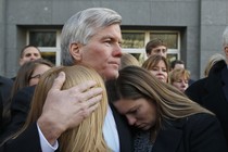 In this Tuesday, Jan. 6, 2015, file photo, former Virginia Gov. Bob McDonnell, center, hugs his daughters Cailin Young, left, and Jeanine McDonnell Zubowsky, right, after speaking outside federal court in Richmond, Va. McDonnell was sentenced to two years prison and two years probation in his corruption case.