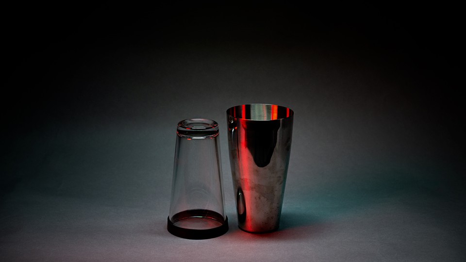 A photo illustration of a beer glass and cocktail mixer
