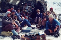 Plane crash survivors sitting in the snow