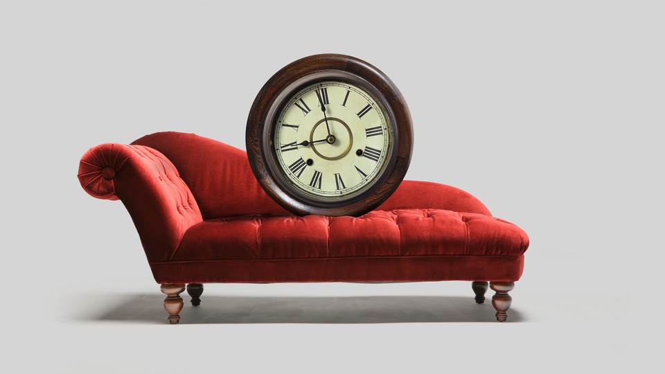 A chaise with a large clock placed on it