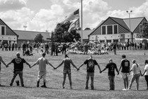 A news photo of a vigil at Apalachee High School, Georgia, marking a recent mass shooting there.