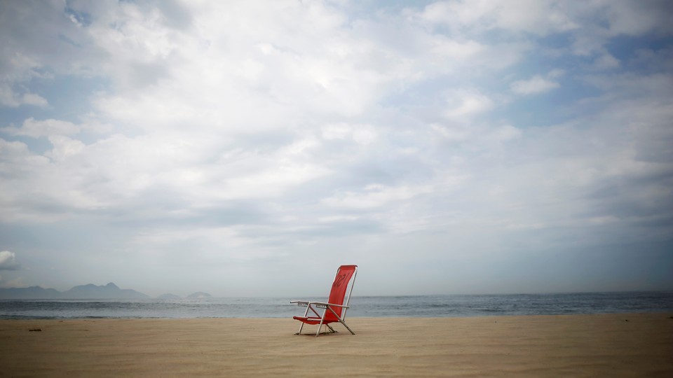 A folding chair on a beach
