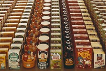 Rows of boxes of processed packaged foods, including quaker oats and cereal.