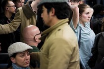 riders crowd the cars of the Paris Metro