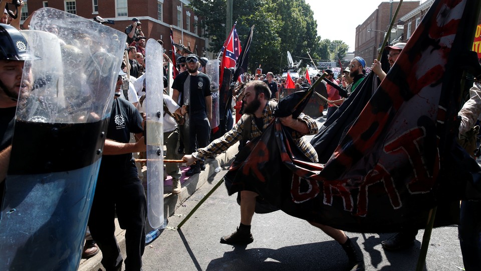 Members of white nationalist groups clash with counter-protesters in Charlottesville, Virginia