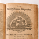 photo of the title page of The Pennsylvania Magazine, with engraved illustration of American symbols, from July 1776