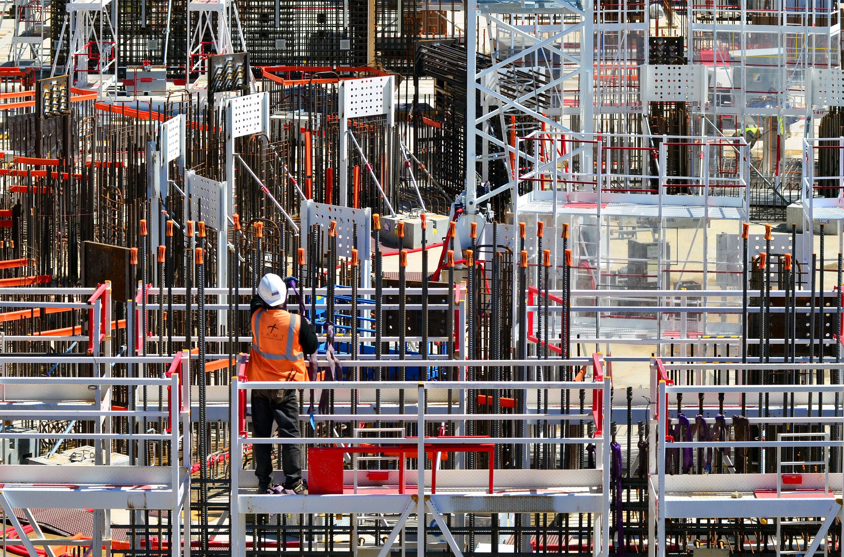 A virtual forest of rebar and supports, seen inside a complex construction site
