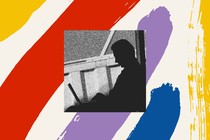 Silhouette of man working on laptop