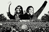 Greta Thunberg and Malala Yousafzai in front of a crowd