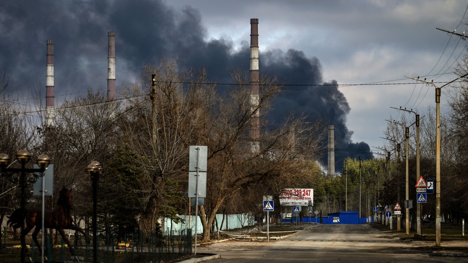 Smoke rises from a power station as tension rises after Russia's recognition of Ukraine's breakaway regions in Schastia town of Luhansk, Ukraine on February 22, 2022.