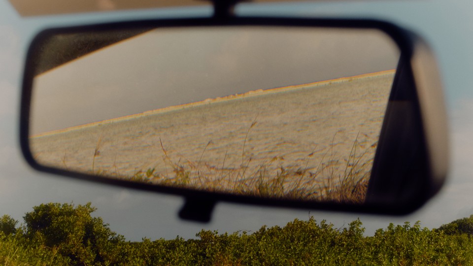 A photo of a car's rearview mirror