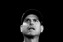 A black-and-white photo of Jim Harbaugh