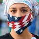 A health worker wearing an American-flag face mask