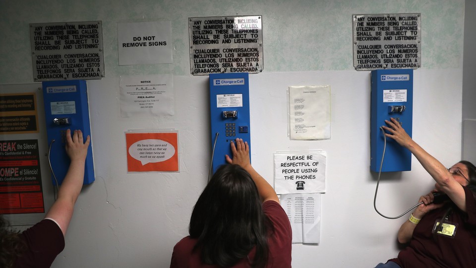 Women make phone calls at the York Community Reintegration Center, a unit in a Connecticut state prison.