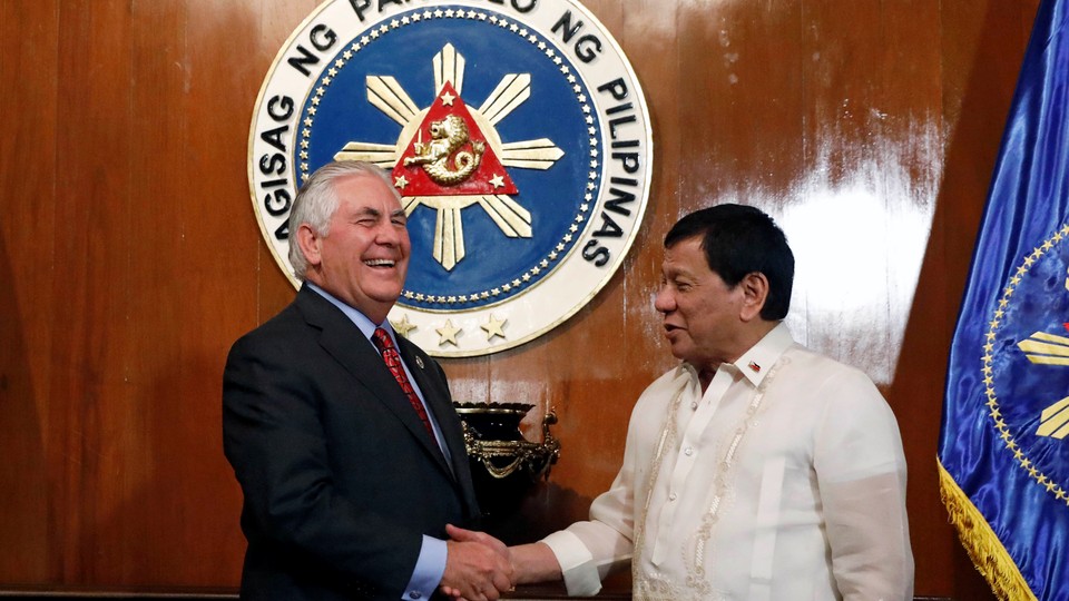 Philippine President Rodrigo Duterte shakes hands with visiting U.S Secretary of State Rex Tillerson
