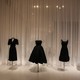 Little black dresses on display on mannequins
