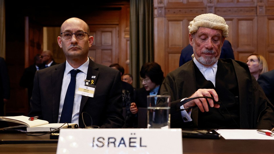 Israeli deputy attorney general for international law Gilad Noam and British jurist Malcolm Shaw sit on the day the International Court of Justice rule on emergency measures against Israel following accusations by South Africa that the Israeli military operation in Gaza is a state-led genocide, in The Hague, Netherlands, January 26, 2024.
