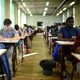 Students take an exam in class.