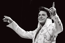 Dwight Icenhower dressed as Elvis on stage