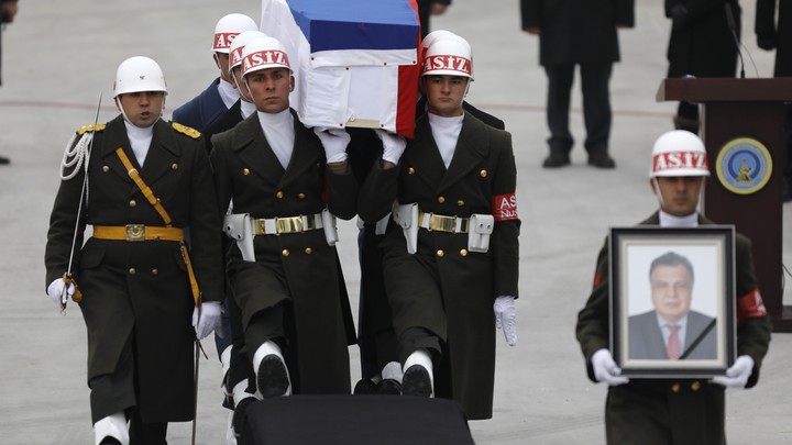 Flag-wrapped coffin of late Russian Ambassador to Turkey Andrey Karlov is carried to a plane during a ceremony at Esenboga airport in Ankara, Turkey on December 20, 2016.
