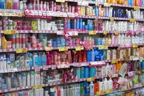 Rows of colorful cosmetics bottles