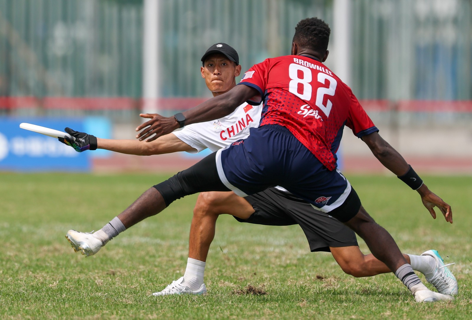 One competitor tries to block another during an ultimate flying disc match.
