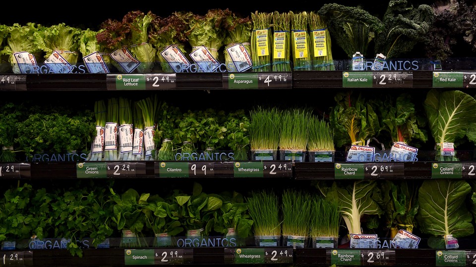 Leafy green vegetables on shelves in a grocery store
