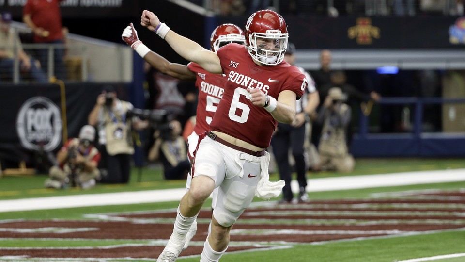 Oklahoma quarterback Baker Mayfield celebrates throwing a long pass for a touchdown