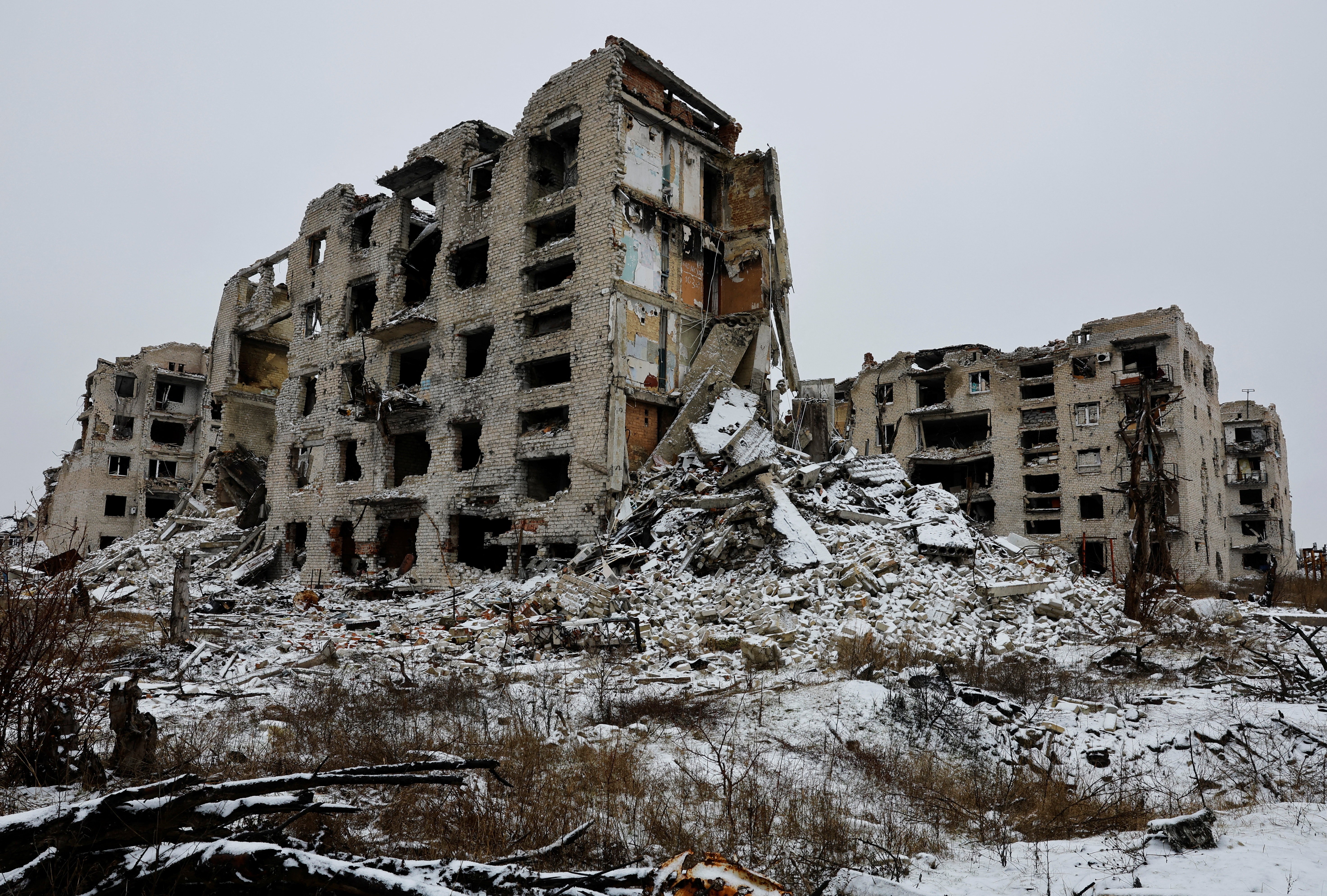 The ruins of tall residential buildings, destroyed in war.