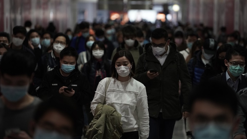 People in Hong Kong wearing face masks.