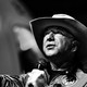 A photograph of Jeff Bezos, wearing a cowboy hat and a flight suit, taken after his successful trip to the edge of space