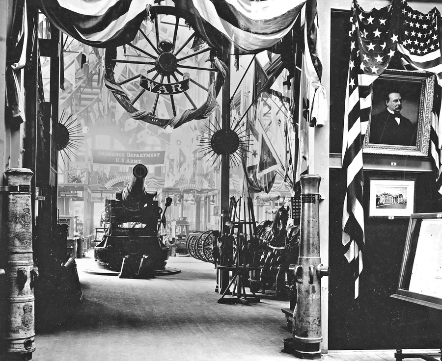 An exhibit space displays cannons, rifles, bayonets, and more.