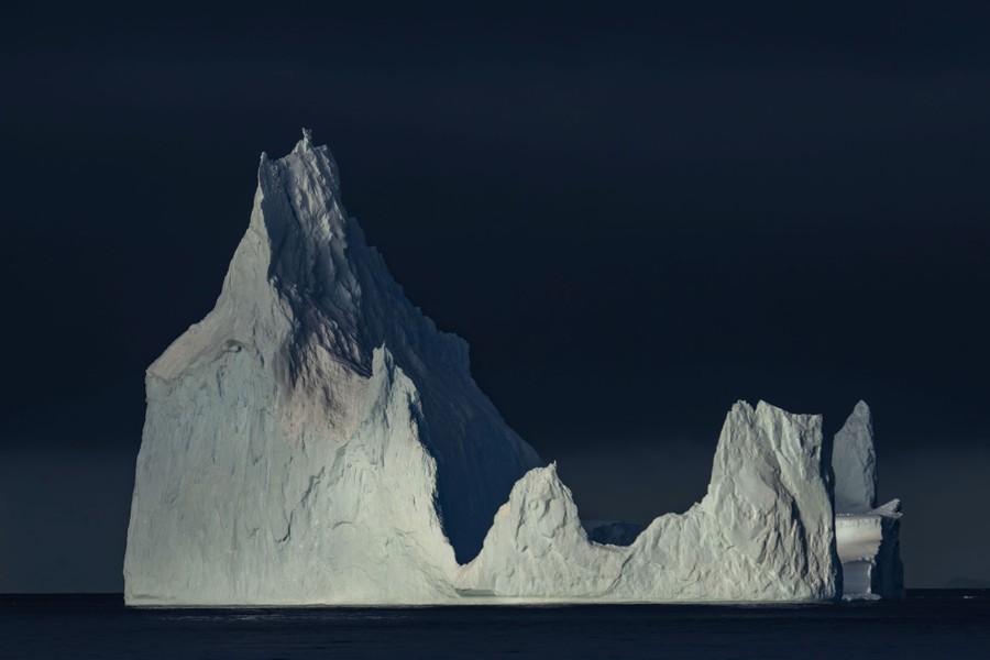 A large iceberg with several pointed spires