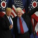Newt Gingrich introducing Donald Trump in front of American flags during a 2016 rally in Ohio