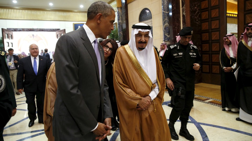 President Barack Obama walks with Saudi King Salman.