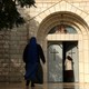 Christian worshippers arrive to attend Christmas Day Mass at the Roman Catholic Church of Holy Family in Gaza City on December 25, 2017.
