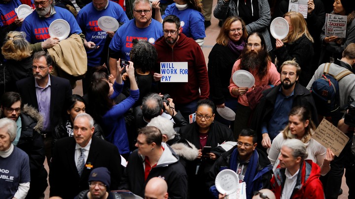Union members and other demonstrators hold protest of partial U.S government shutdown in Washington