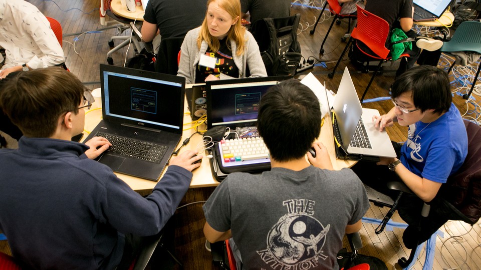 Members of "Hoya Haxa," a team of Georgetown University students, participate in a hacking competition.