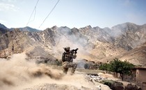 In Kunar Province's volatile Pech River Valley, a U.S. Army soldier fires a rocket-propelled grenade during a firefight with Taliban insurgents.
